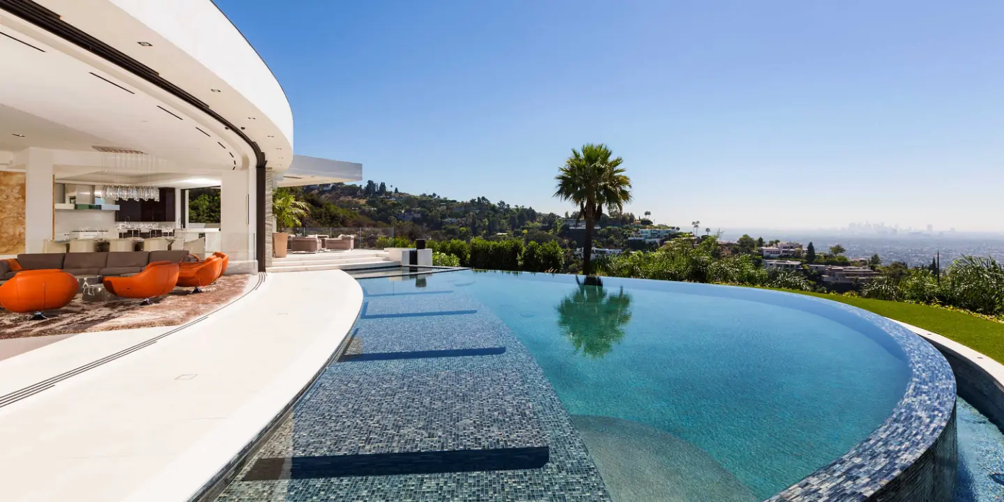 Exterior of a Roman James Designed Mansion Overlooking an infinity pool